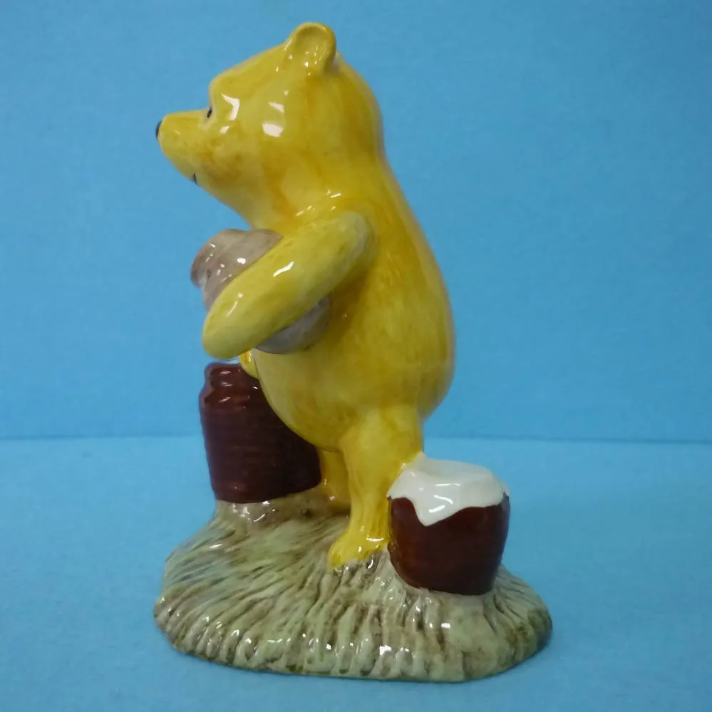 A Boxed Royal Doulton Winnie The Pooh Figurine - Pooh Counting The Honeypots